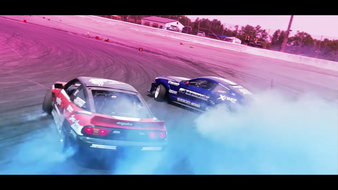 Three CMD drivers running door-to-door through tire smoke at Hickory Motor Speedway
