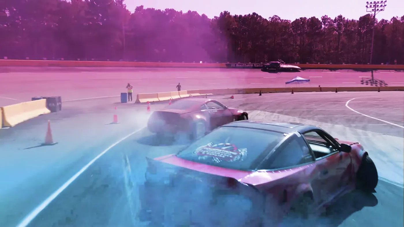 Two CMD drift cars in a close night tandem